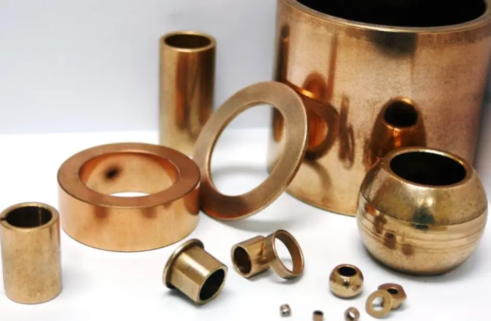 Different shiny brass products showcasing variety in size and design 