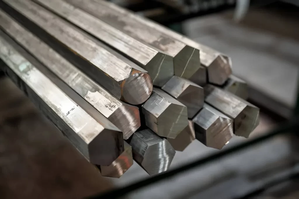 The image shows a bundled stack of hexagonal bar stock.