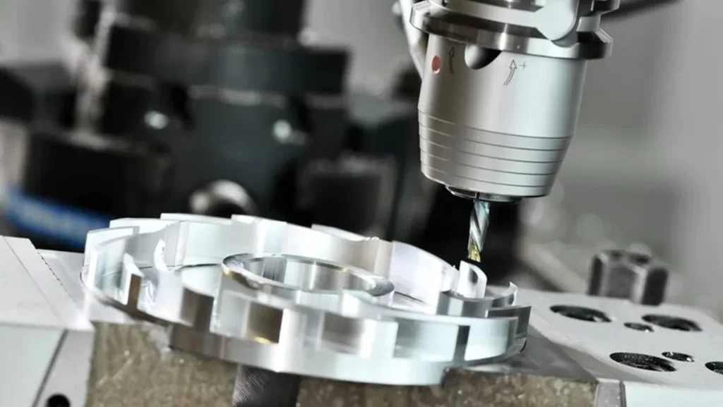 CNC machine working on metal part.