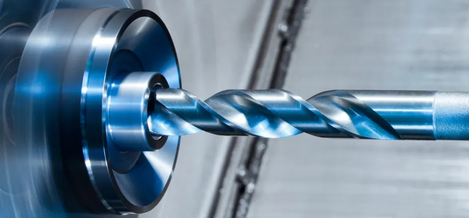 CNC drilling a rotating workpiece
