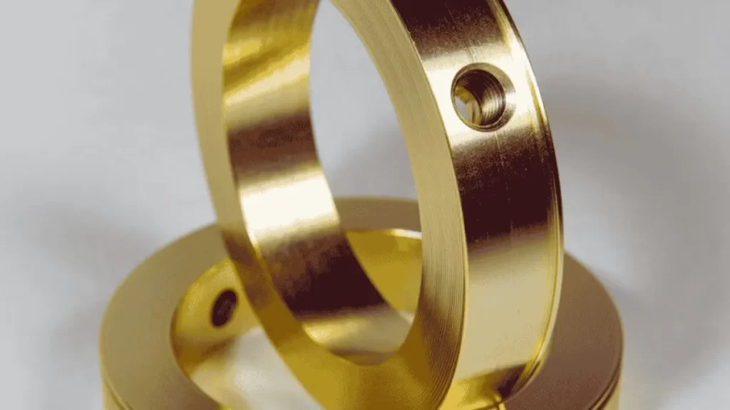 The image shows a set of cadmium-plated rings with holes.