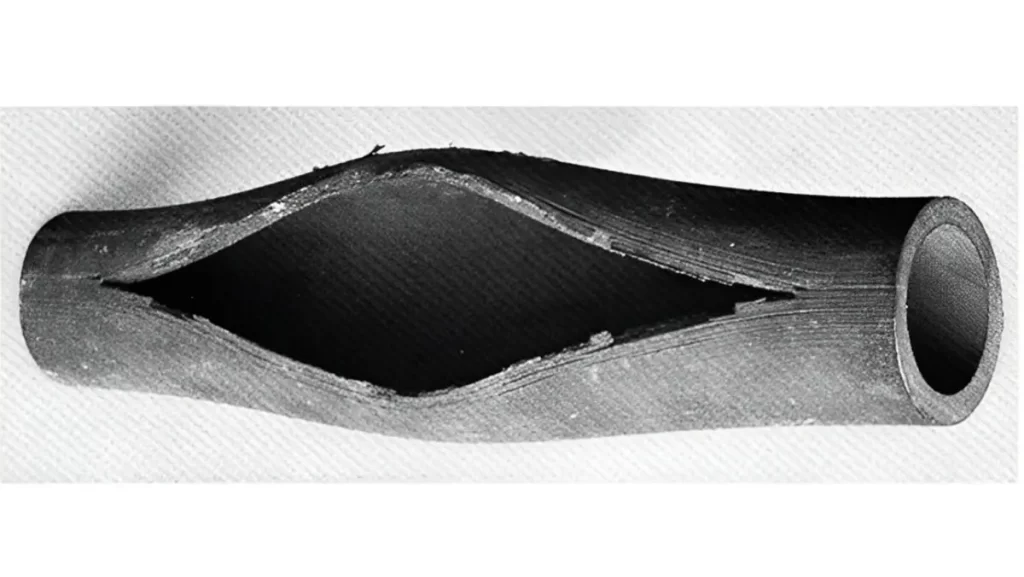 Pipe shows creep deformation, an elongated oval rupture.