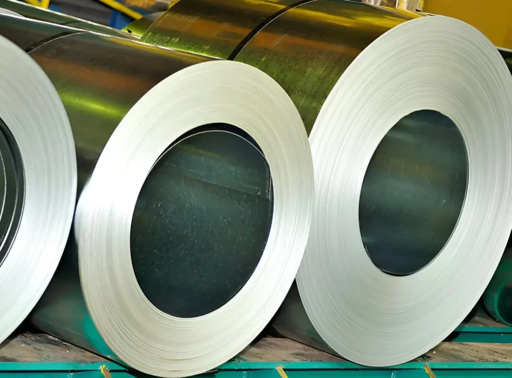 The image shows galvanized roll steel stock in industrial inventory.