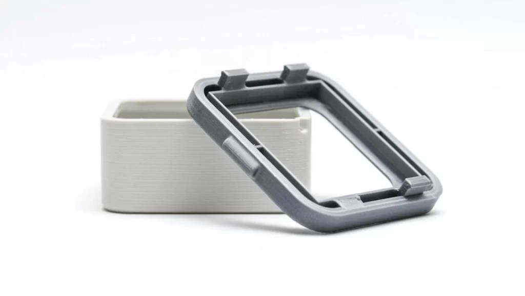 A gray and white snap-fit plastic enclosure.