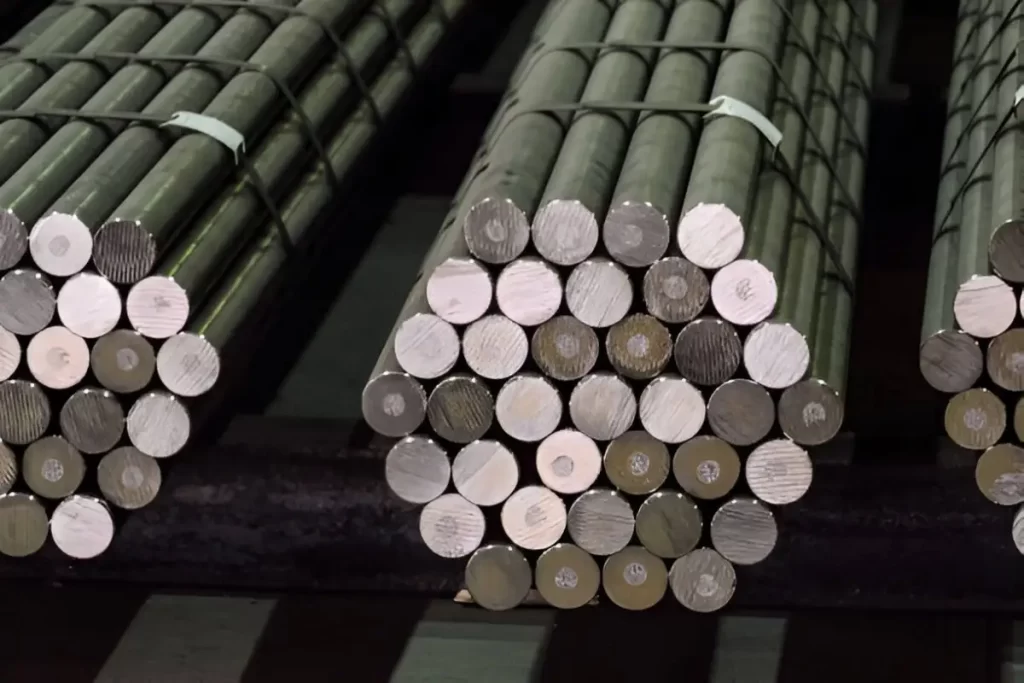 The image shows bundled metal rod stock.