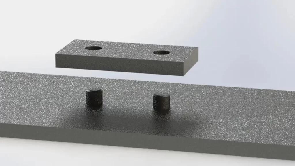 Two metal parts with corresponding holes.
