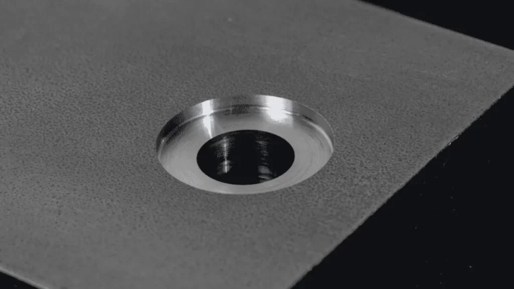 The image shows a spotface hole with a smooth, shiny surface finish.