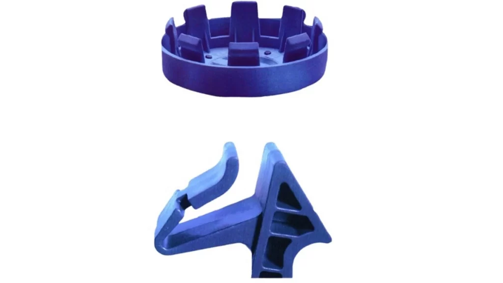 Blue plastic torsion snap fit components.
