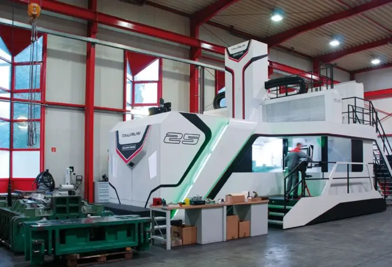 A large white vertical milling center, the type typically equipped with multiple spindles for large production volumes