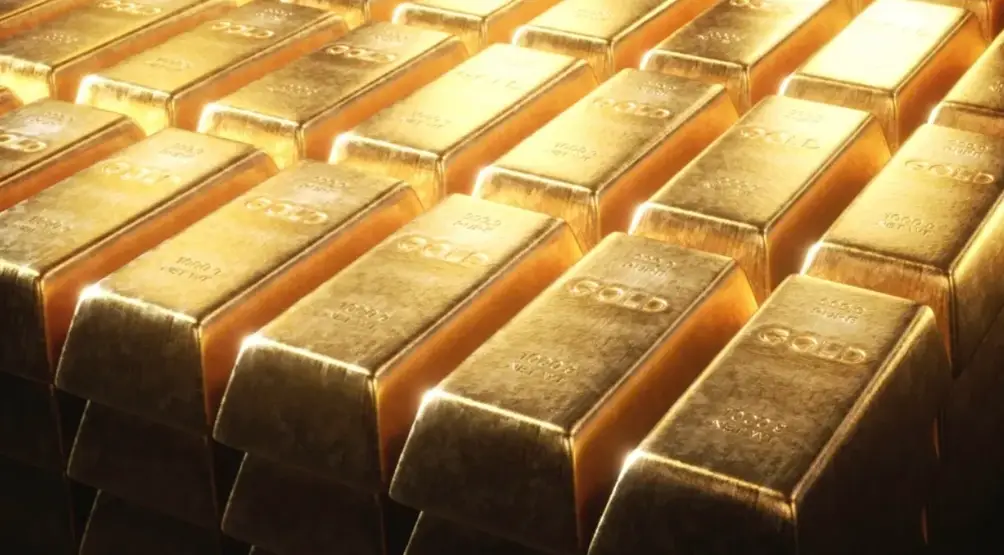 A closeup of shiny bars of gold arranged neatly 