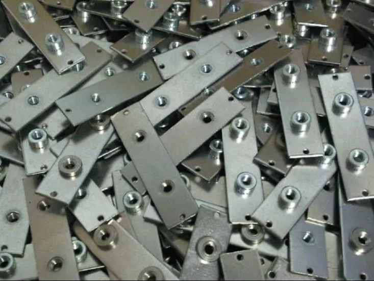 A collection of rectangular plates with circular holes and protrusions