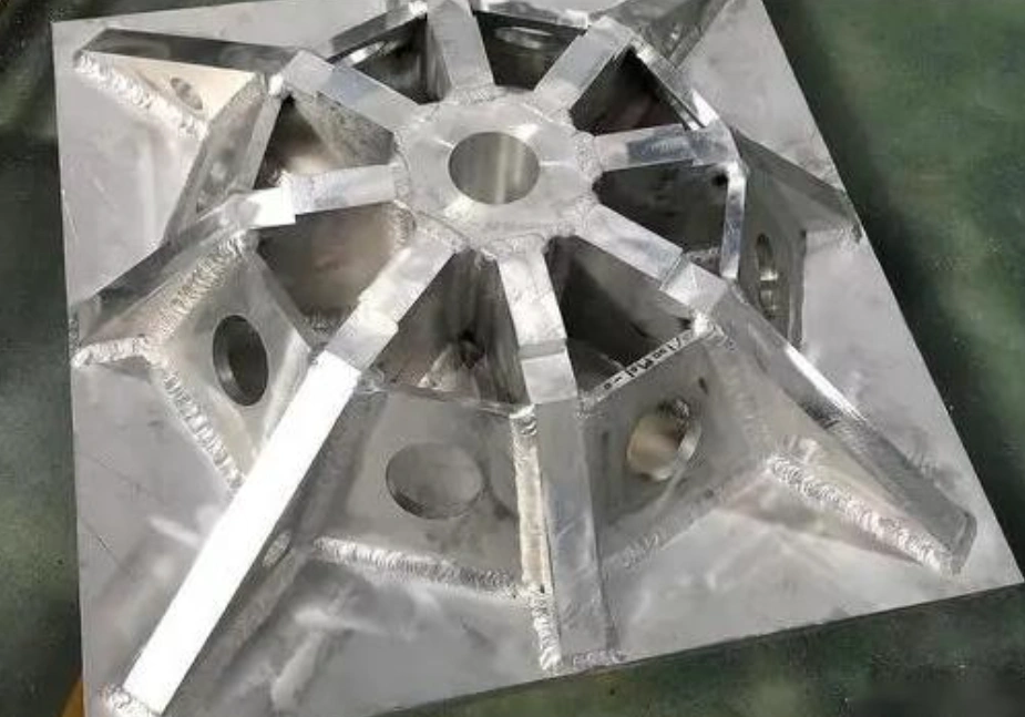 A 6061-T6 aluminum component with several plates welded together