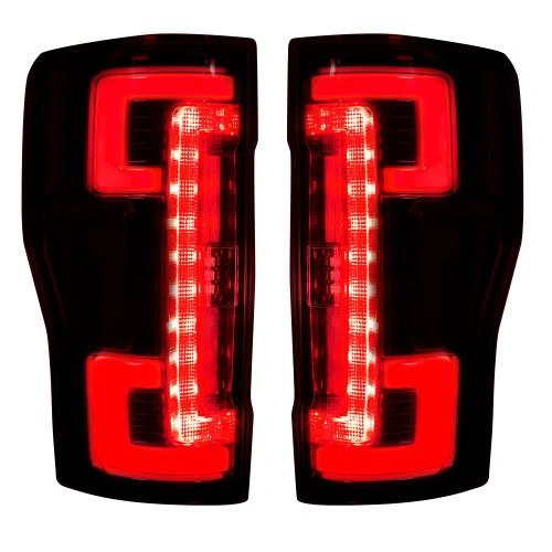 An image of two fiber optic taillights glowing red 