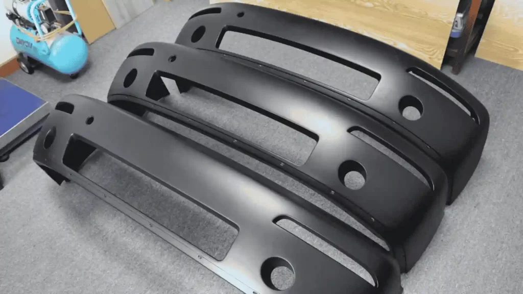 Image of identical black color Injection Molded parts displayed.