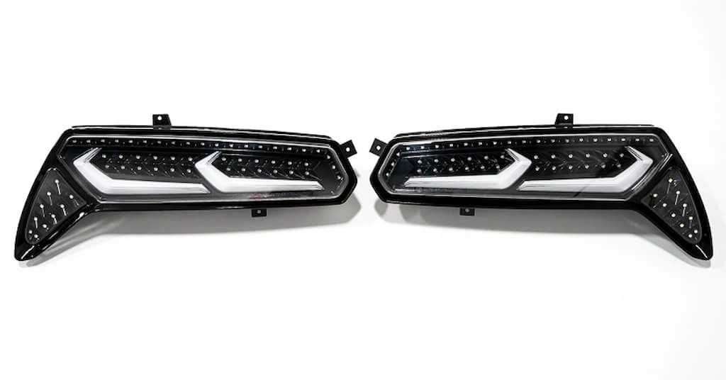 Two LED taillights of a car with custom LED strips and aesthetic cover. 