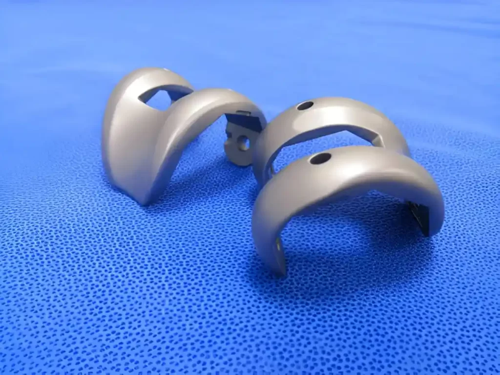 A close-up of a TKR surgical femoral component.