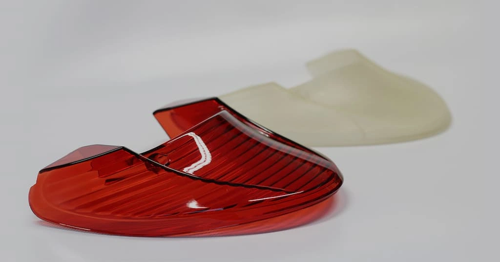 An image showing a vacuum cast tail light and a silicone mold 