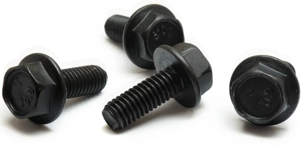 Four black oxide coated monster bolts for aircraft on a white surface