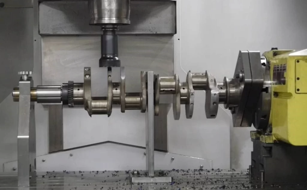 CNC machine cutting a crankshaft