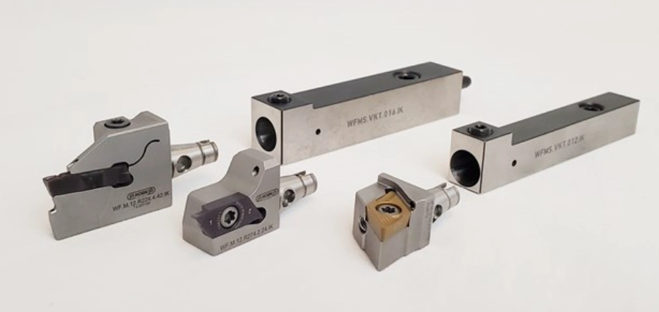 Various cutting tools and tooling components designed specifically for Swiss turning operations