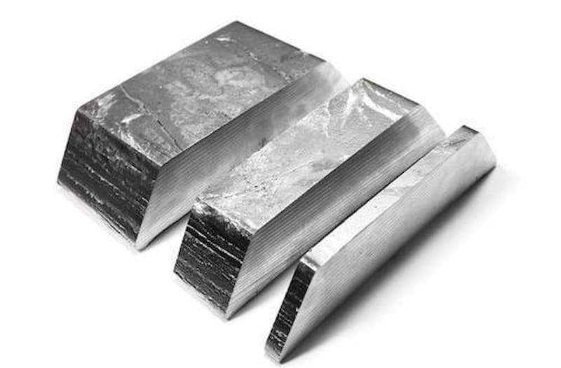 An image showing three slices of pure zinc metal 