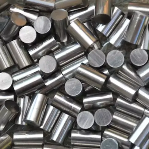 Shiny nickel alloy metal rods in bulk.
