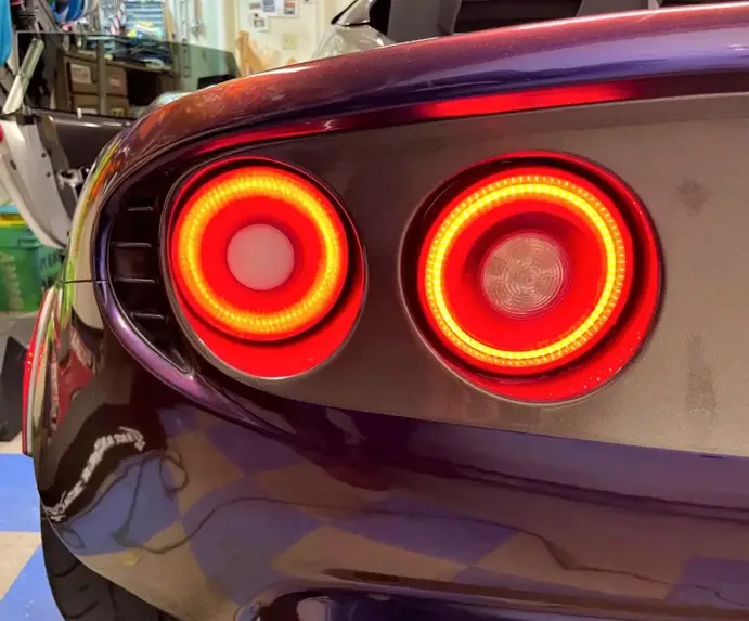 Circular 3D printed LED tail lights with red and amber ring patterns 