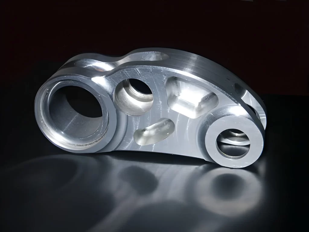 A clear depiction of a CNC-machined aluminum component for motor racing applications.
