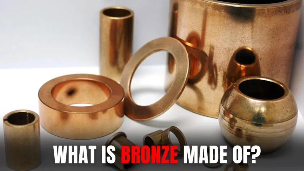 A close-up of various bronze components, including rings and tubes.