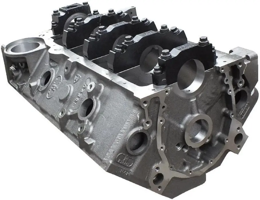 Cast iron automotive engine block showing cylinder bores, main bearing caps, and mounting surfaces