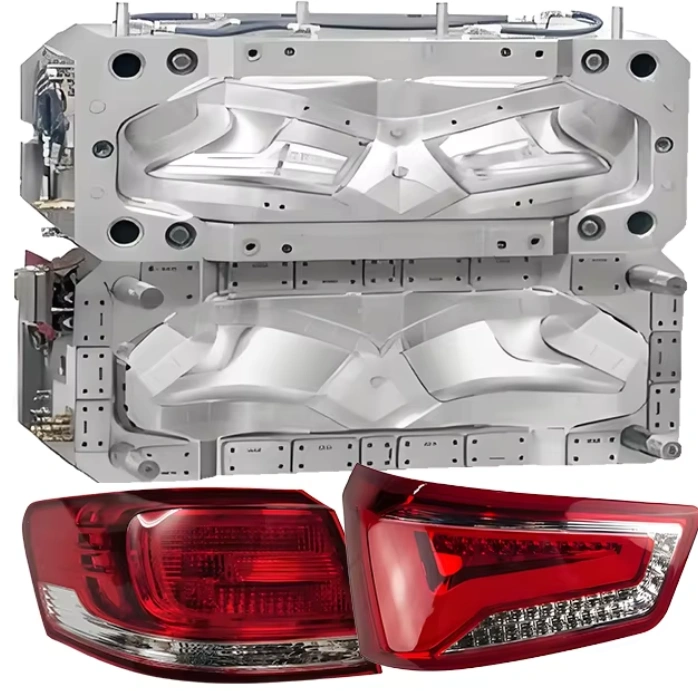 Injection molding tool showing cavity and core halves with finished red tail light lenses