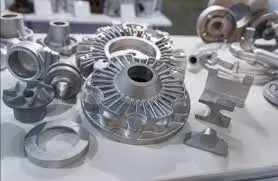 Aluminum parts displayed on a white surface.