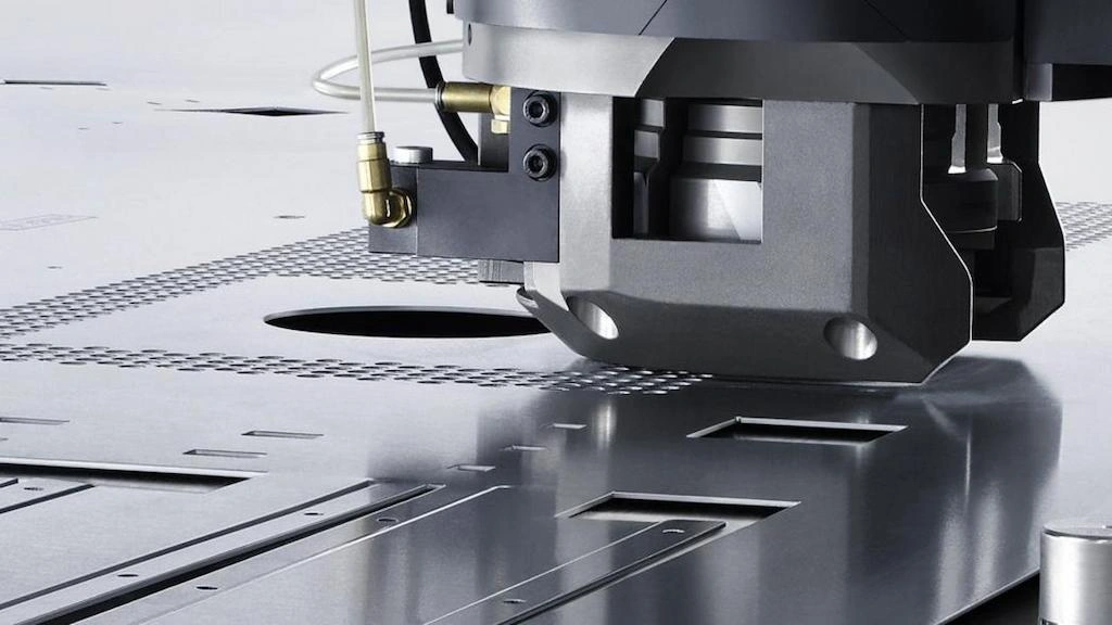 a close-up view of the hole punching process 