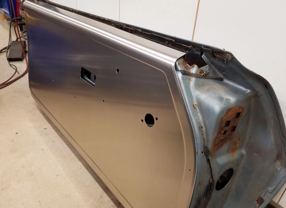 Formed aluminum blank for automotive door panel