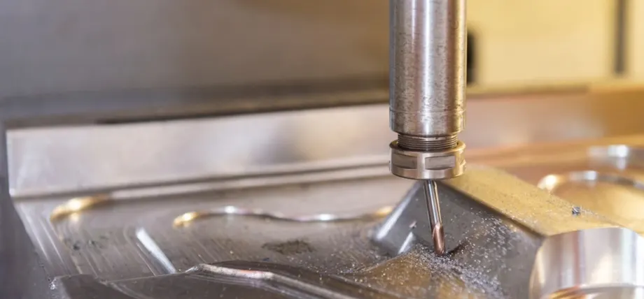 CNC Milling cutter bent over a metal workpiece