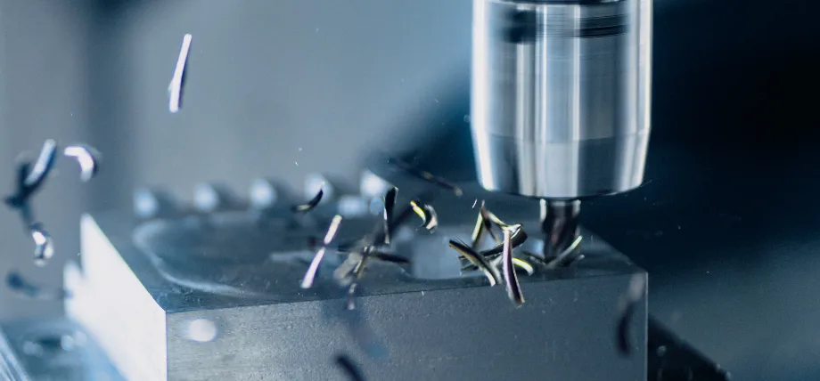 Chips flying away from a cutting zone of a CNC milling center