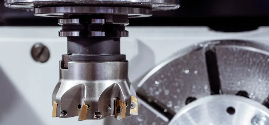 Close-up of a multi-tooth milling cutter and spindle joint