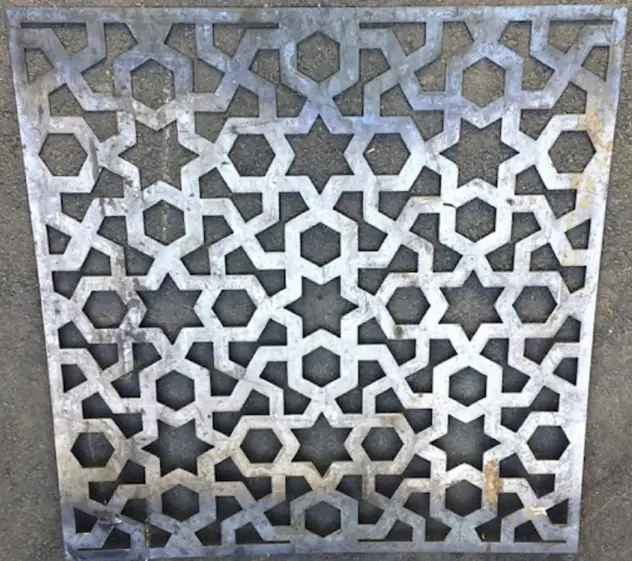Plasma-cut sheet metal panel with geometric star pattern