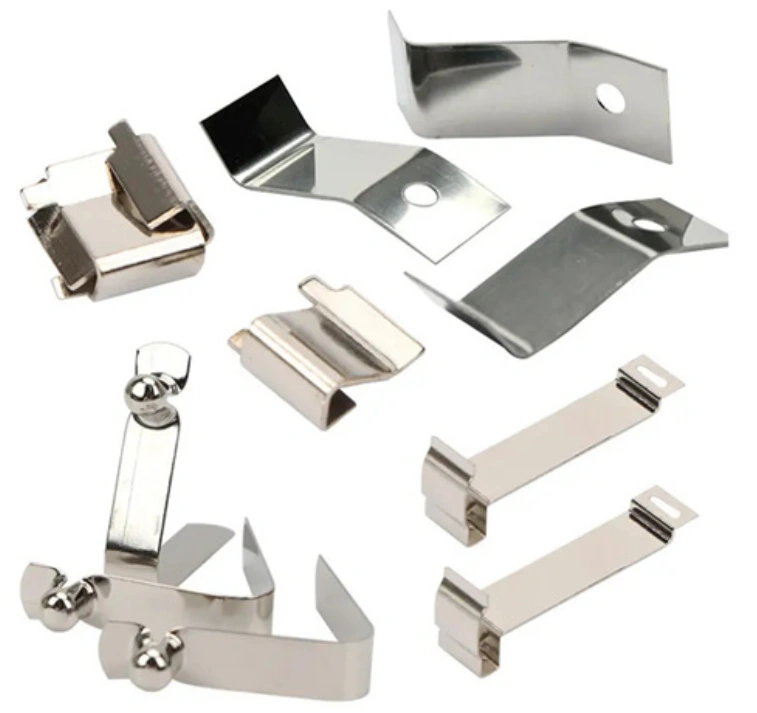 Assorted metal stamped clips, brackets, and spring contacts for electronics assembly