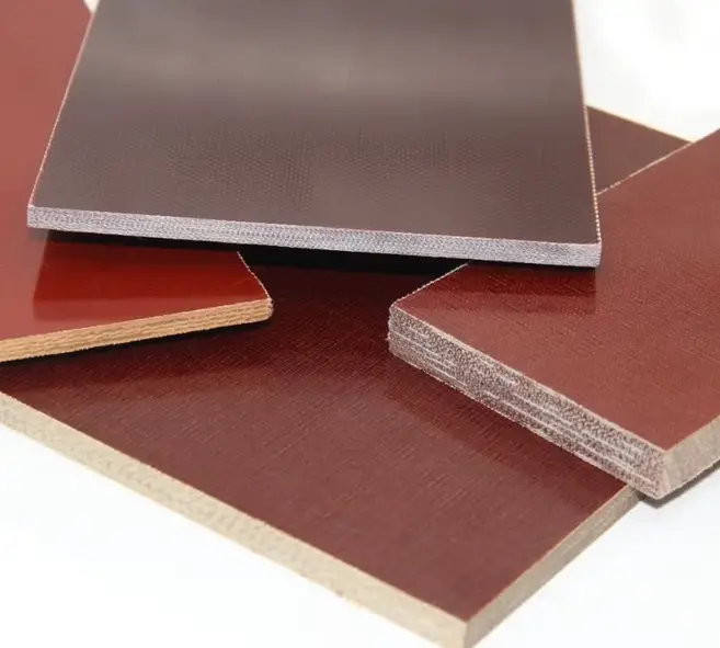 Paper-based Bakelite phenolic sheets in brown and red tones showing fabric texture