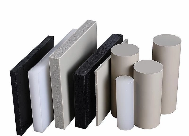 An image showing polypropylene rods and blocks having black, grey, and white colors