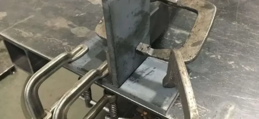 Metal clamping setup used to prevent warping during welding