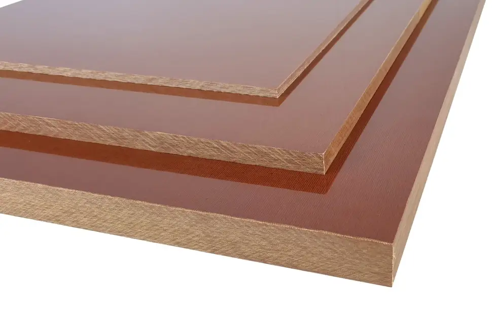 Cloth-based phenolic resin sheets in brown tones, showing various thicknesses and layered construction
