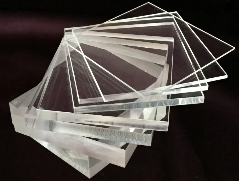 Stack of extruded acrylic sheets showing uniform thickness and consistent transparency in various sizes
