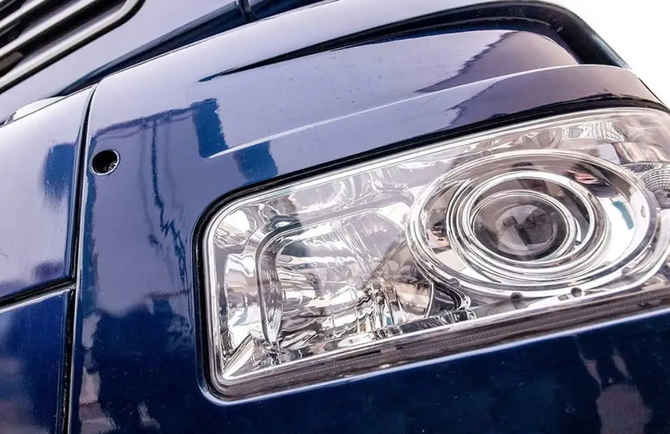 Extruded acrylic automotive headlight lens showing cost-effective manufacturing and good light transmission