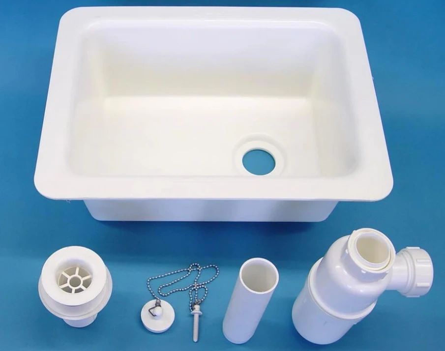 Polypropylene lab sink basin with drain assembly, stopper, overflow pipe, and P-trap components