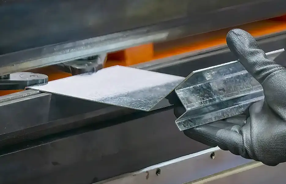Metal sheet being bent in a press brake machine