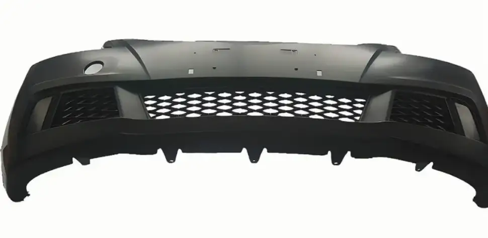 Black ABS plastic automotive bumper with integrated mesh grille and aerodynamic design