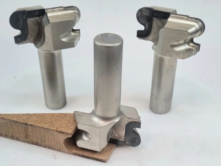 PCD (polycrystalline diamond) cutting tools for ceramic CNC machining with a ceramic workpiece sample showing a machined edge