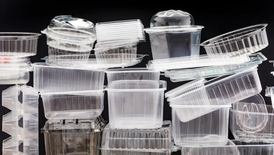 Assorted clear plastic food containers and lids made from recyclable thermoplastic materials